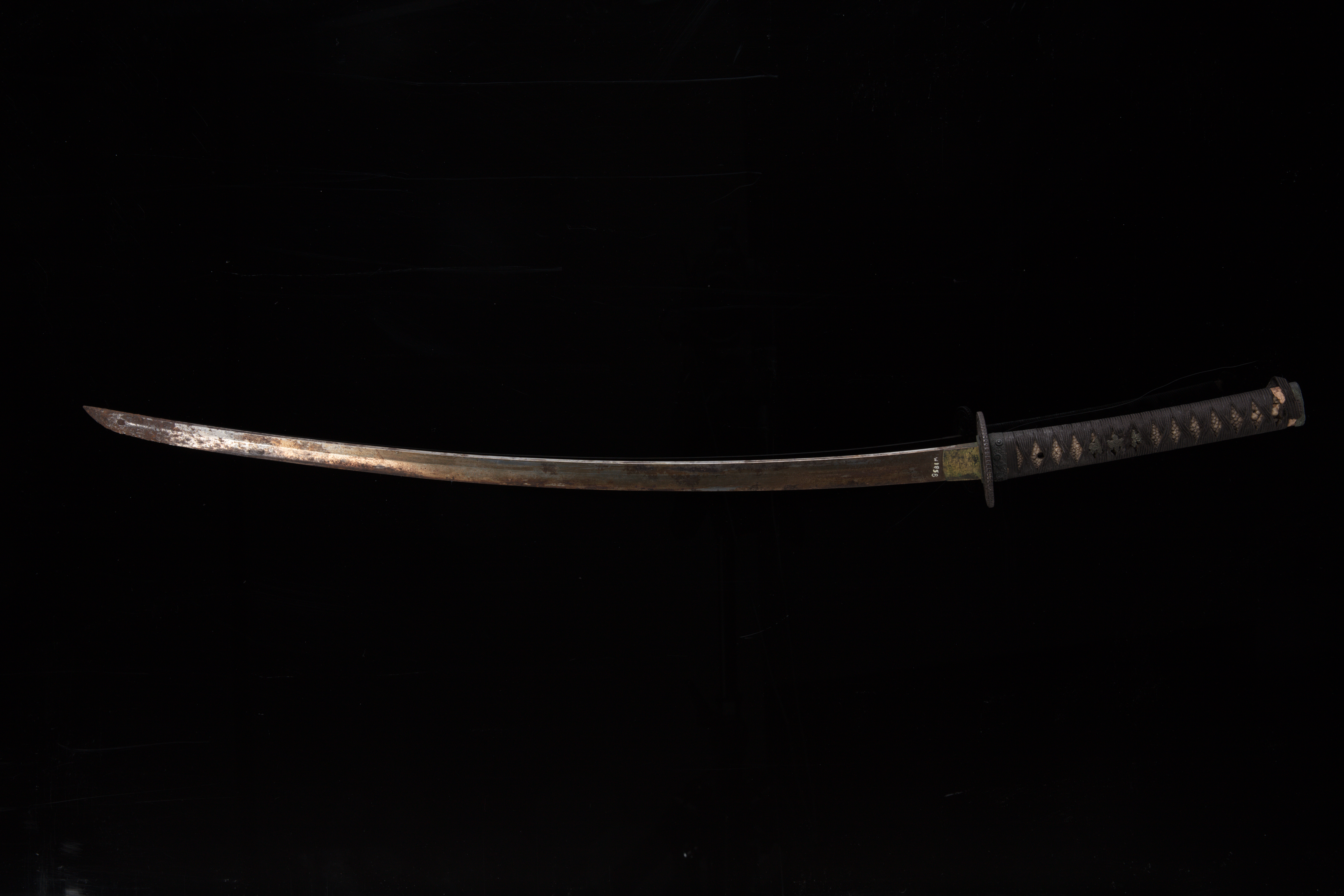 Close-up of a samurai katana sword hilt and scabbard